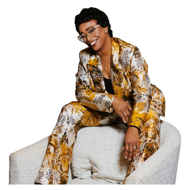Ceva Brown, UGC creator, seated in a floral suit
